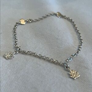 Costume silver toned bracelet with charms